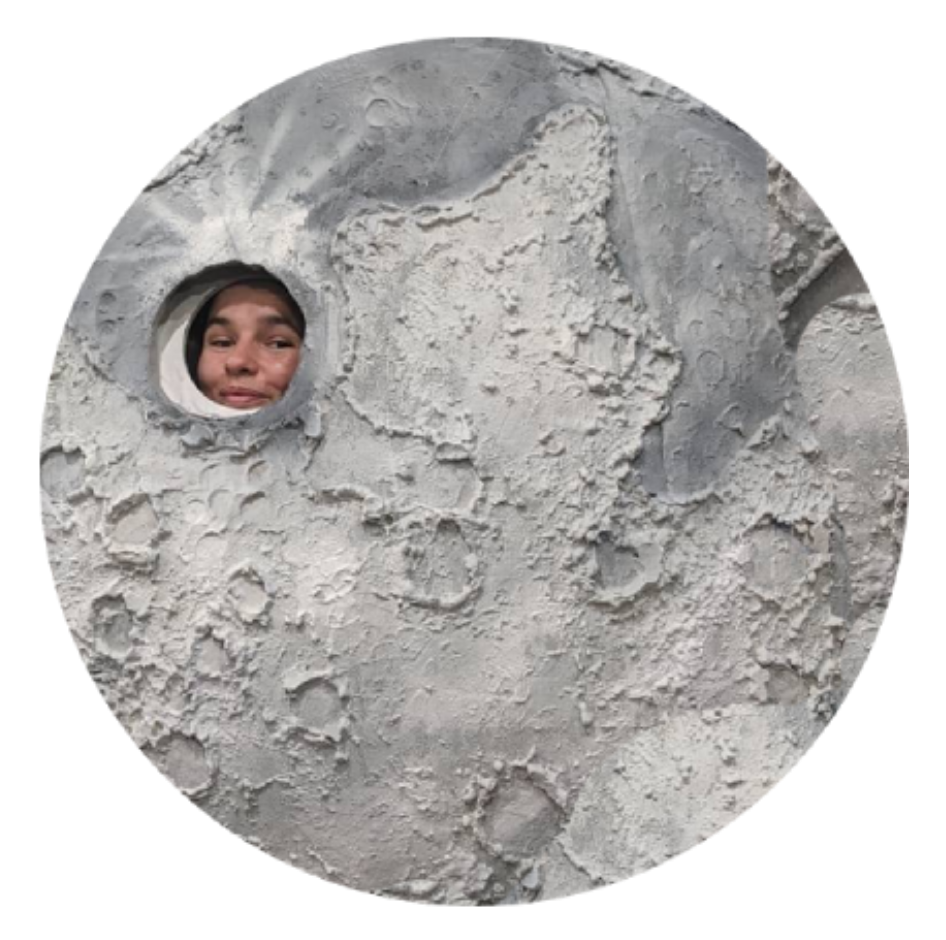 Meg peeks out from within a large model moon, located in the Belgrade Natural History Museum.